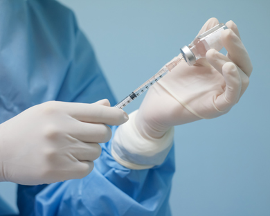 vitamin shot being prepared by nurses hands